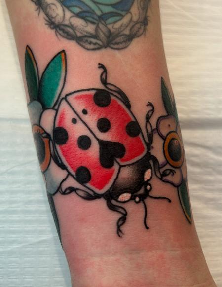 Kenel Figueroa - Ladybug tattoo